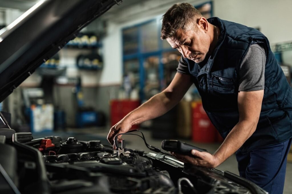 Mechanic testing a car engine